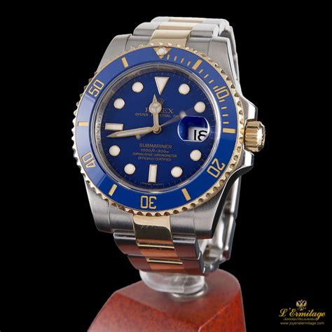 rolex acero y oro corona azul